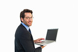 Smiling businessman using a laptop