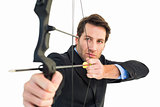 Close up of businessman shooting bow and arrow