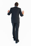Rear view of businessman pushing with hands