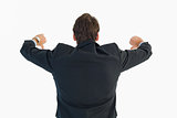 Rear view of businessman gesturing thumbs down