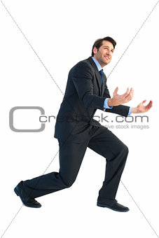 Businessman carrying something heavy with his hands