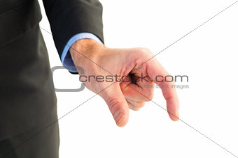Businessman measuring something with these fingers