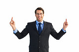 Smiling businessman pointing with both fingers