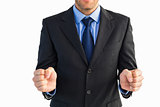Businessman standing clenching his fists