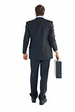 Rear view of businessman holding a briefcase