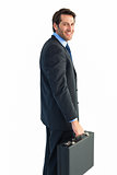 Smiling businessman holding a briefcase