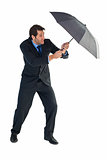 Man holding umbrella to protect himself from the rain