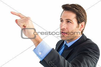 Serious businessman pointing at something