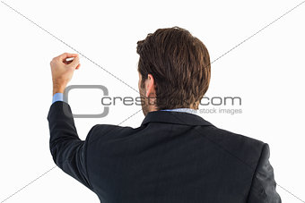 Rear view of businessman writing with a white chalk