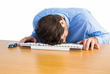 Businessman sleeping on his keyboard