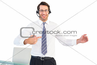 Businessman using a headset while presenting with hands