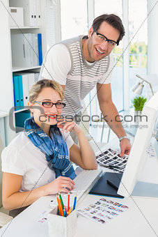 Smiling photo editors using computer