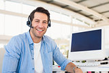 Portrait of a smiling photo editor wearing a headset