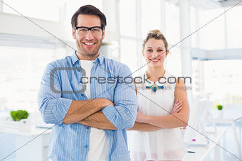 Smilling photo editor posing with arms crossed
