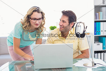 Creative business people working together on computer