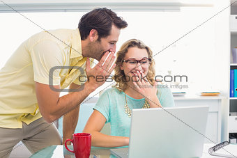 Cheerful creative business laughing while working