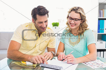 Creative business team working with a notepad