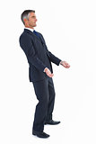 Cheerful businessman posing with arms out