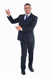 Smiling businessman in suit doing gesture
