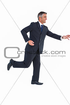 Smiling businessman posing with arms out