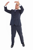 Businessman standing and doing gesture