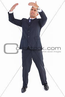 Businessman standing and doing gesture