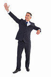 Happy businessman standing and waving