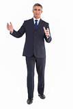 Smiling businessman standing with arms out