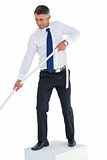 Businessman standing on cube pulling rope