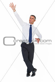Portrait of a smiling businessman waving