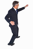Businessman in suit posing with his arms out