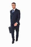 Businessman walking and holding briefcase