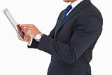 Businessman with watch using tablet pc