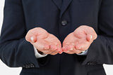 Mid section of a businessman with hands out