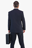 Rear view of a businessman holding briefcase