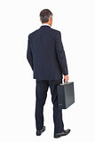 Businessman in suit holding a briefcase