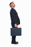 Businessman standing and holding briefcase