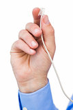 Hand of a businessman holding a white cable