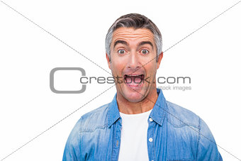 Portrait of a excited man in casual clothes