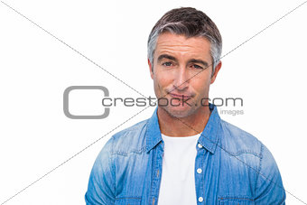 Portrait of a unsure man in casual clothes