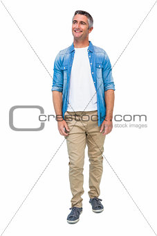 Smiling man in casual clothes posing