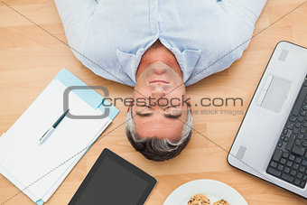 Man lying and sleeping on the floor