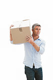 Smiling man carrying cardboard box