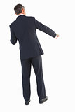 Businessman in suit standing and doing gesture