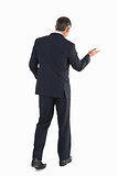 Businessman walking and doing gesture
