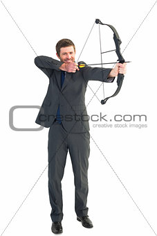 Businessman shooting a bow and arrow