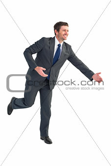 Businessman walking with his hands out