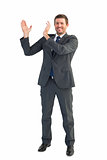 Happy businessman with hands up