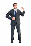 Businessman smiling with hands up