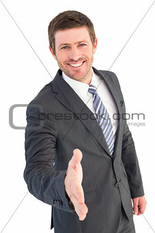 Businessman smiling and offering his hand